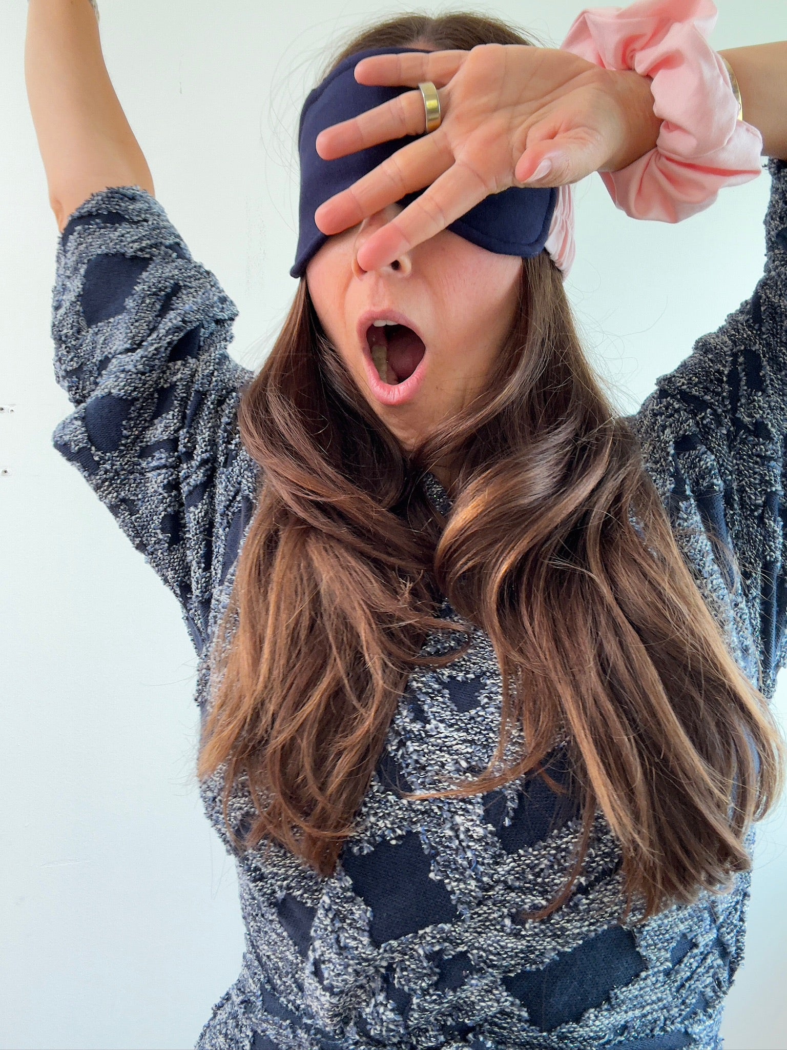 woman in reverie robe with pink scrunchie