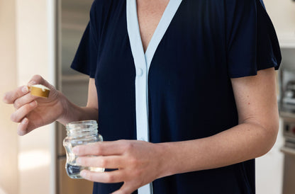 postpartum mom making bottle